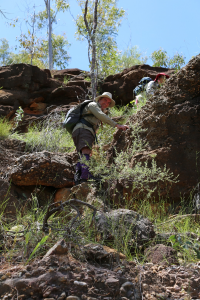 A band of conglomerate separates the sandstone from the slaty ancient metasediments below