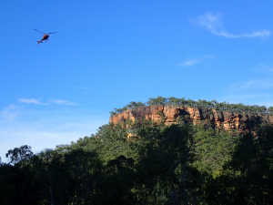 Red cliffs, blue skies, and the wing-beat of our day-end transport (image credit S. Nally)