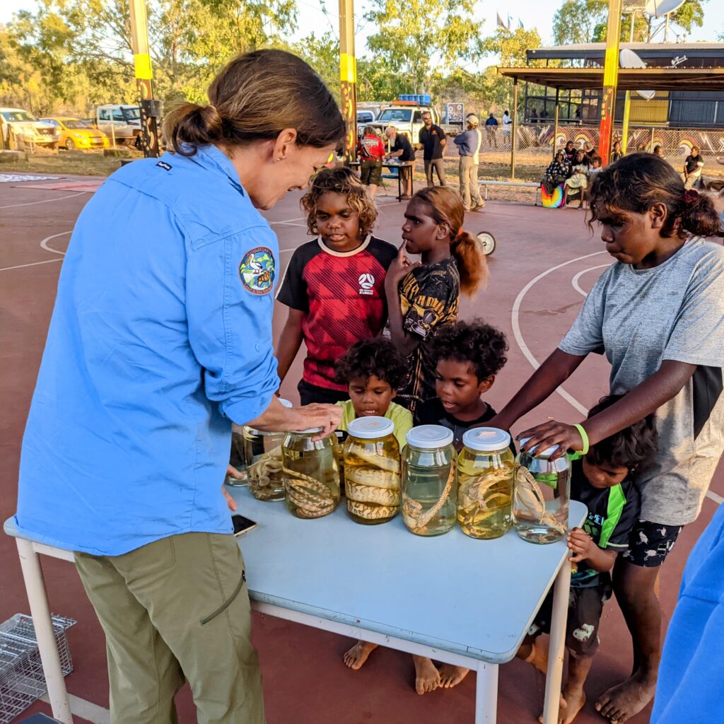 A land manager and scientists engaging with an Indigenous community