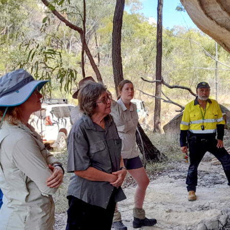 Scientists listening to a Traditional Owner sharing his knowledge