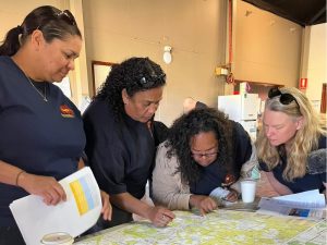 Bush Blitz Manager, Jo Harding (far right), discussing sites with rangers on the Tjiwarl Bush Blitz 2023